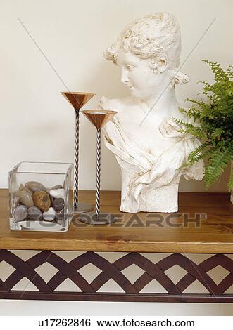 Stock Photograph - Wooden table and chairs in conservatory dining room with wooden flooring. Fotosearch