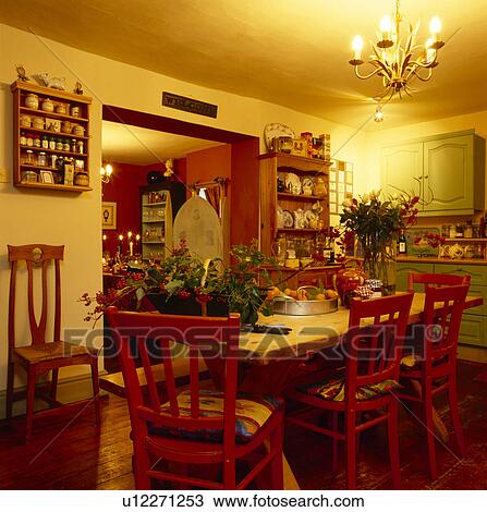 Wooden Table And Painted Red Chairs In Small Yellow Dining Room Decorated For Christmas Stock Image U12271253 Fotosearch