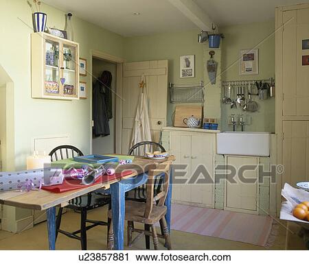 Wrapping paper on wooden table in economy-style country kitchen View Large Photo Image Stock Image - Wrapping paper on wooden table in economy-style country kitchen. Fotosearch