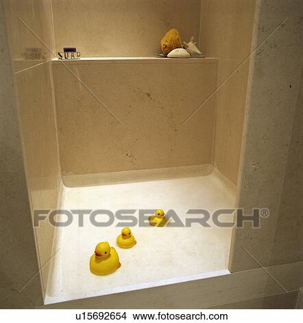 Yellow plastic ducks in modern white shower room View Large Photo Image Picture - Yellow plastic ducks in modern white shower room. Fotosearch