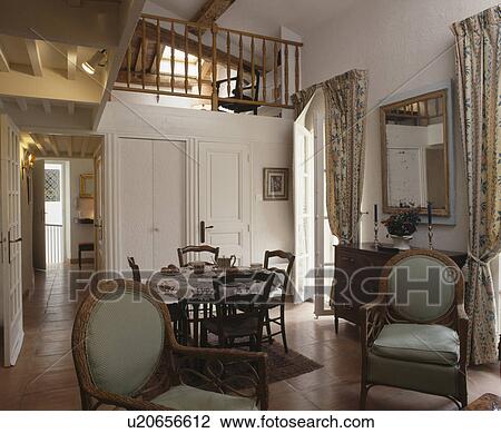 Antique chairs in small loft conversion apartment View Large Photo Image Stock Image - Antique chairs in small loft conversion apartment. Fotosearch