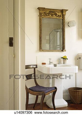 Antique Georgian mirror above white pedestal basin in townhouse bathroom View Large Photo Image Stock Photograph - Antique Georgian mirror above white pedestal basin in townhouse bathroom. Fotosearch