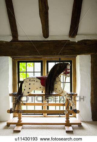 Antique swing-stand rocking horse in front of landing window View Large Photo Image Stock Image - Antique swing-stand rocking horse in front of landing window. Fotosearch