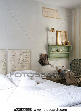 Bed with upholstered headboard with writing script pattern View Large Photo Image Stock Photo - Bed with upholstered headboard with writing script pattern. Fotosearch