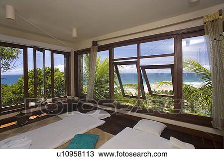 Bedroom looking onto ocean in Brazillian Beach house. View Large Photo Image Stock Image - Bedroom looking onto ocean in Brazillian Beach house.. Fotosearch