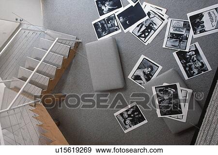 Stock Photo - Birdseye view of hall with large black+white photographs lying on grey carpet. Fotosearch