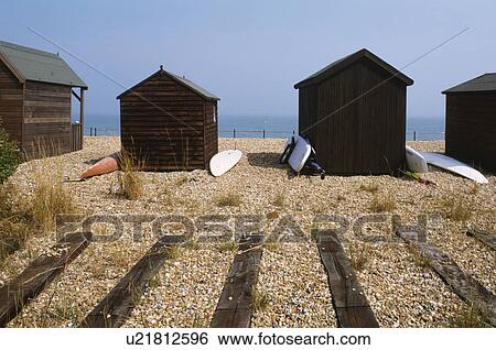 Black wooden beach huts on shingle beach at Kingsdown in Kent View Large Photo Image Stock Photograph - Black wooden beach huts on shingle beach at Kingsdown in Kent. Fotosearch