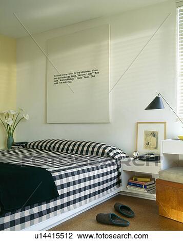 Black+white checked bedlinen and black throw on bed in modern white bedroom View Large Photo Image Stock Image - Black+white checked bedlinen and black throw on bed in modern white bedroom. Fotosearch