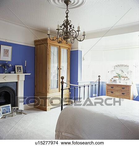 Blue and white bedroom with large wardrobe and chandelier View Large Photo Image Picture - Blue and white bedroom with large wardrobe and chandelier. Fotosearch