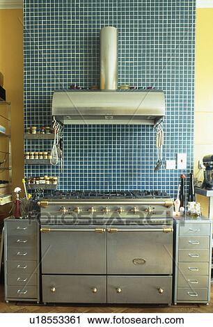 Blue mosaic-tiled splashback above stainless steel oven in modern kitchen View Large Photo Image Stock Image - Blue mosaic-tiled splashback above stainless steel oven in modern kitchen. Fotosearch