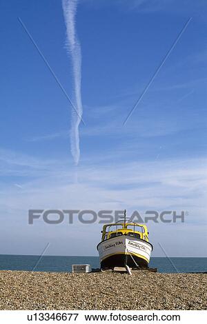 Blue sky above boat on shingle beach at Deal in Kent View Large Photo Image Stock Photo - Blue sky above boat on shingle beach at Deal in Kent. Fotosearch