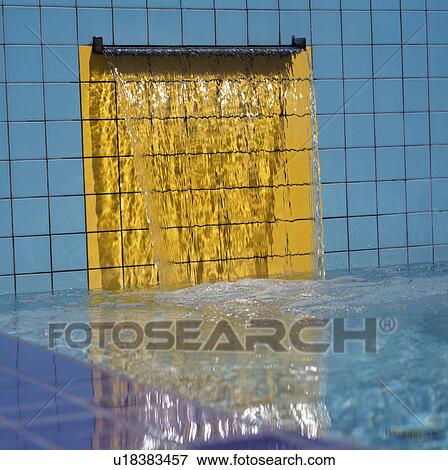 Blue tiled wall with water pouring over yellow tiles to modern pool View Large Photo Image Stock Photo - Blue tiled wall with water pouring over yellow tiles to modern pool. Fotosearch