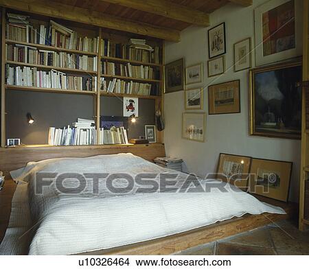 Bookshelves And Spotlights Above Divan Bed With White Bedcover In Small Bedroom Picture