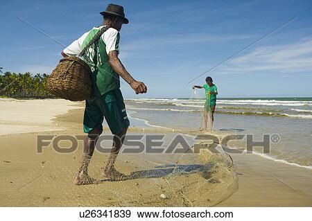 Stock Photo - Brazil. Fishermen. Nets. Basket.. Fotosearch