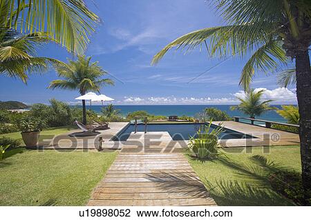 Brazil. Outdoor pool. Wood pathway. Ocean View. View Large Photo Image Stock Image - Brazil. Outdoor pool. Wood pathway. Ocean View.. Fotosearch