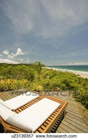Brazil. Reclining chairs. Beach view. View Large Photo Image Stock Photo - Brazil. Reclining chairs. Beach view.. Fotosearch