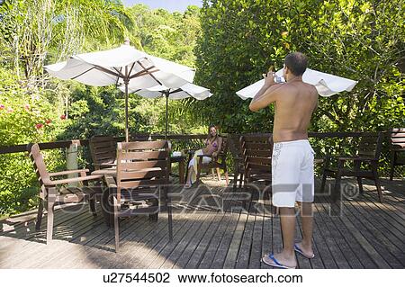 Brazil. Wood deck. Couple. View Large Photo Image Stock Image - Brazil. Wood deck. Couple.. Fotosearch