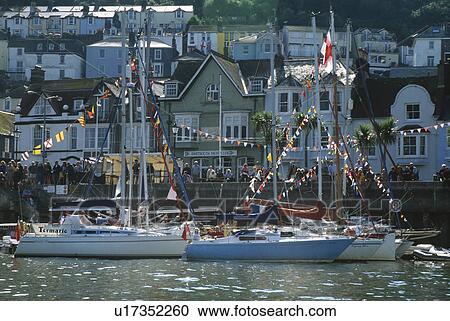 Bunting on sailing boats in Dartmouth Harbour in Devon England View Large Photo Image Stock Image - Bunting on sailing boats in Dartmouth Harbour in Devon England. Fotosearch