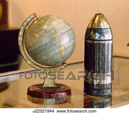 Close-up of antique world globe and metal canister View Large Photo Image Picture - Close-up of antique world globe and metal canister. Fotosearch