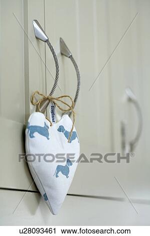 Close-up of blue+white heart-shaped lavender bag on cupboard door View Large Photo Image Stock Image - Close-up of blue+white heart-shaped lavender bag on cupboard door. Fotosearch