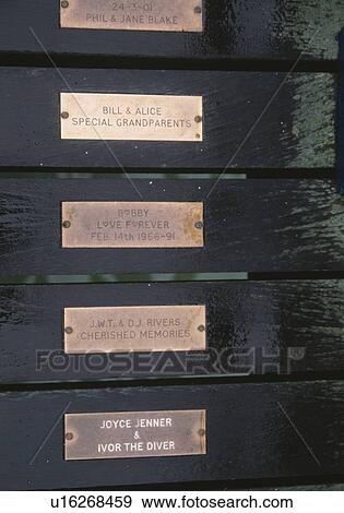 Stock Photo - Close up of brass memorial tablets in Swanage. Fotosearch