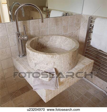 Close up of chrome tap and circular limestone basin in modern bathroom View Large Photo Image Stock Image - Close up of chrome tap and circular limestone basin in modern bathroom. Fotosearch