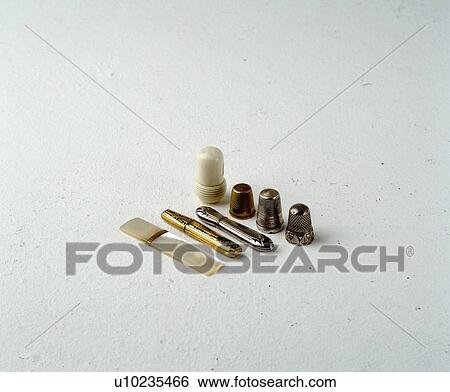 Close-up of collection of antique metal thimbles View Large Photo Image Stock Photograph - Close-up of collection of antique metal thimbles. Fotosearch