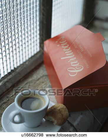 Close-up of cup of coffee and box of chocolates View Large Photo Image Stock Photo - Close-up of cup of coffee and box of chocolates. Fotosearch