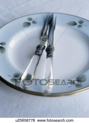 Close-up of cutlery and plate View Large Photo Image Stock Photo - Close-up of cutlery and plate. Fotosearch