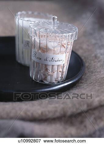Close-up of faux rose-petals in lidded glass jars View Large Photo Image Stock Photo - Close-up of faux rose-petals in lidded glass jars. Fotosearch