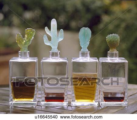 Close-up of four glass decanters with novelty glass stoppers View Large Photo Image Stock Image - Close-up of four glass decanters with novelty glass stoppers. Fotosearch