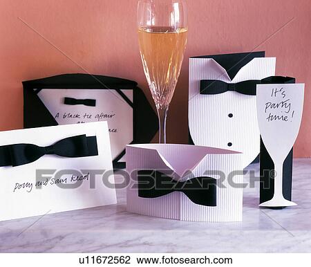 Close-up of home-made party invitations in the shape of white shirt with black bow-tie View Large Photo Image Stock Image - Close-up of home-made party invitations in the shape of white shirt with black bow-tie. Fotosearch