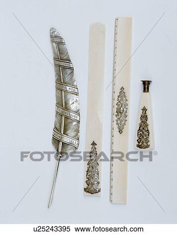 Stock Photography - Close-up of ivory and silver ornaments. Fotosearch
