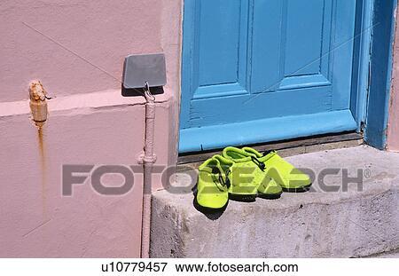 Close up of lime green beach shoes on step of pink house with blue door at Lyme Regis in Dorset View Large Photo Image Stock Photo - Close up of lime green beach shoes on step of pink house with blue door at Lyme Regis in Dorset. Fotosearch