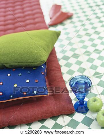 Close-up of lime-green velvet cushion with blue silk cushion on red quilt View Large Photo Image Stock Image - Close-up of lime-green velvet cushion with blue silk cushion on red quilt. Fotosearch
