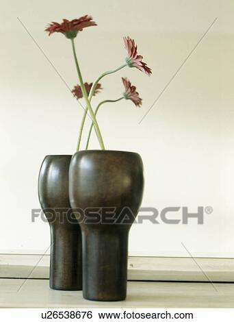 Close-up of modern black vases View Large Photo Image Stock Photograph - Close-up of modern black vases. Fotosearch