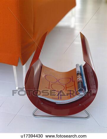 Close-up of modern red magazine rack View Large Photo Image Stock Image - Close-up of modern red magazine rack. Fotosearch
