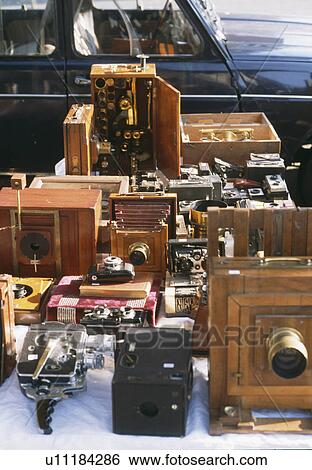 Close-up of old cameras displayed on stall at French street market View Large Photo Image Stock Photograph - Close-up of old cameras displayed on stall at French street market. Fotosearch