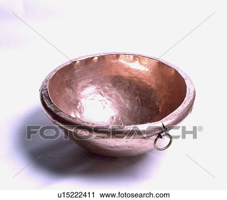Stock Image - Close-up of old copper mixing bowl. Fotosearch