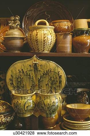 Stock Photo - Close-up of old rustic pottery pots and containers. Fotosearch