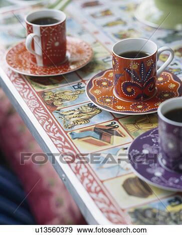 Stock Photo - Close-up of patterned orange coffee-cups. Fotosearch