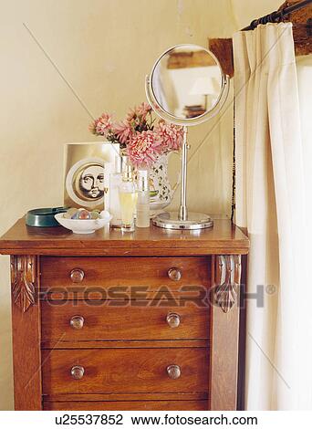 Close-up of pedestal mirror on antique chest-of-drawers View Large Photo Image Stock Image - Close-up of pedestal mirror on antique chest-of-drawers. Fotosearch