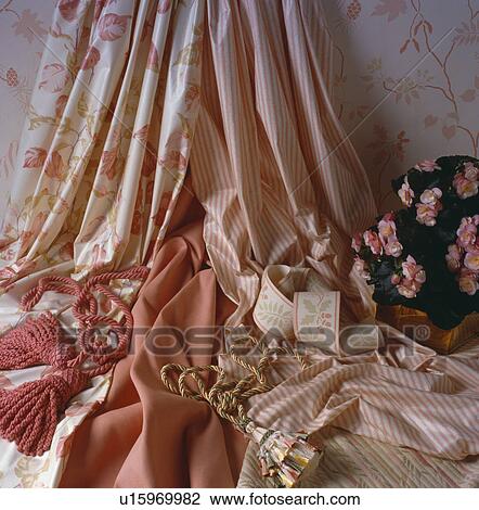 Close-up of pink floral and striped fabric and trimmings View Large Photo Image Stock Image - Close-up of pink floral and striped fabric and trimmings. Fotosearch
