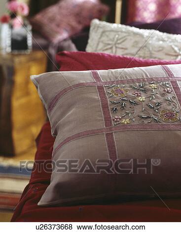 Close-up of pink silk embroidered cushion View Large Photo Image Stock Photo - Close-up of pink silk embroidered cushion. Fotosearch