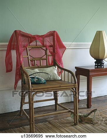 Close-up of red voile shirt on antique chair View Large Photo Image Stock Photography - Close-up of red voile shirt on antique chair. Fotosearch
