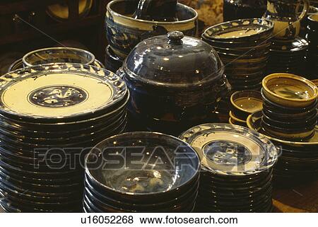 Close-up of rustic pottery plates and bowls View Large Photo Image Stock Photo - Close-up of rustic pottery plates and bowls. Fotosearch