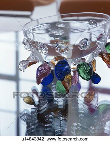 Close-up of stemmed glass decorated with colourful glass pebbles View Large Photo Image Stock Image - Close-up of stemmed glass decorated with colourful glass pebbles. Fotosearch