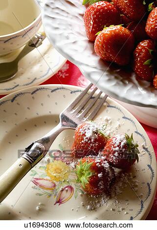 Close-up of strawberries and fork on floral plate View Large Photo Image Stock Photo - Close-up of strawberries and fork on floral plate. Fotosearch