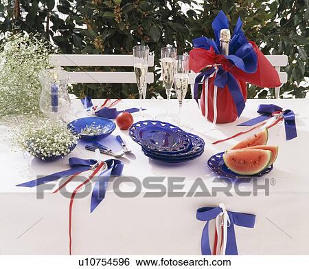 Close-up of table decorated for Bastille DAy with red, white and blue ribbons and bottle of champagne in red paper View Large Photo Image Stock Photograph - Close-up of table decorated for Bastille DAy with red, white and blue ribbons and bottle of champagne in red paper. Fotosearch