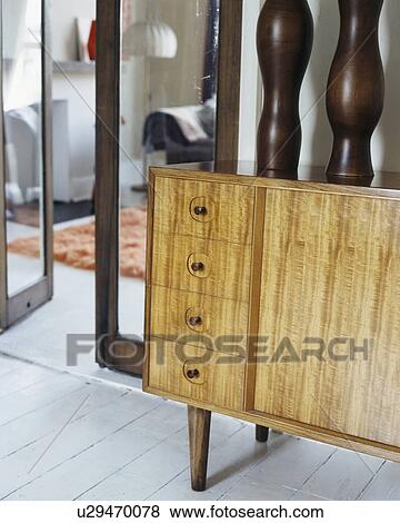 Stock Photo - Close-up of tall black vases on modern sideboard. Fotosearch